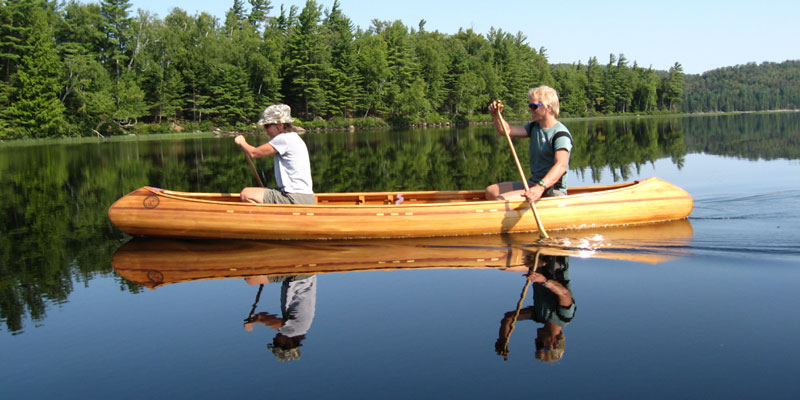 two people canoeing in a Lutra canoe